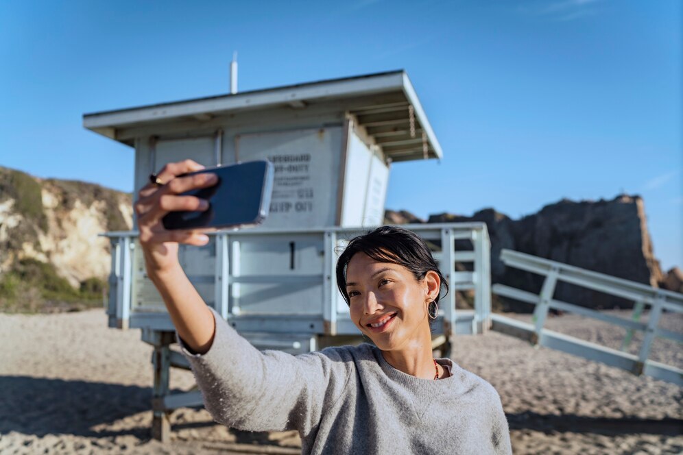 Young woman using a mobile device outdoors. Young woman using a mobile device outdoors.